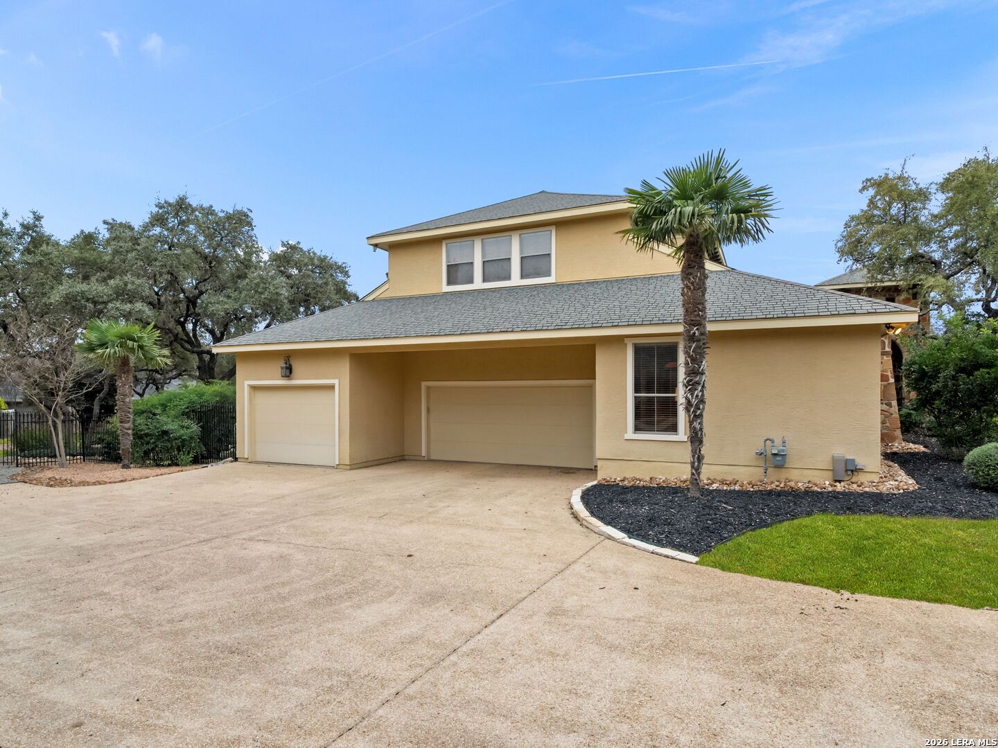 19819 Wild Hollow Garden Ridge, TX 78266 - Photo 48 of 68 a front view of a house with garden