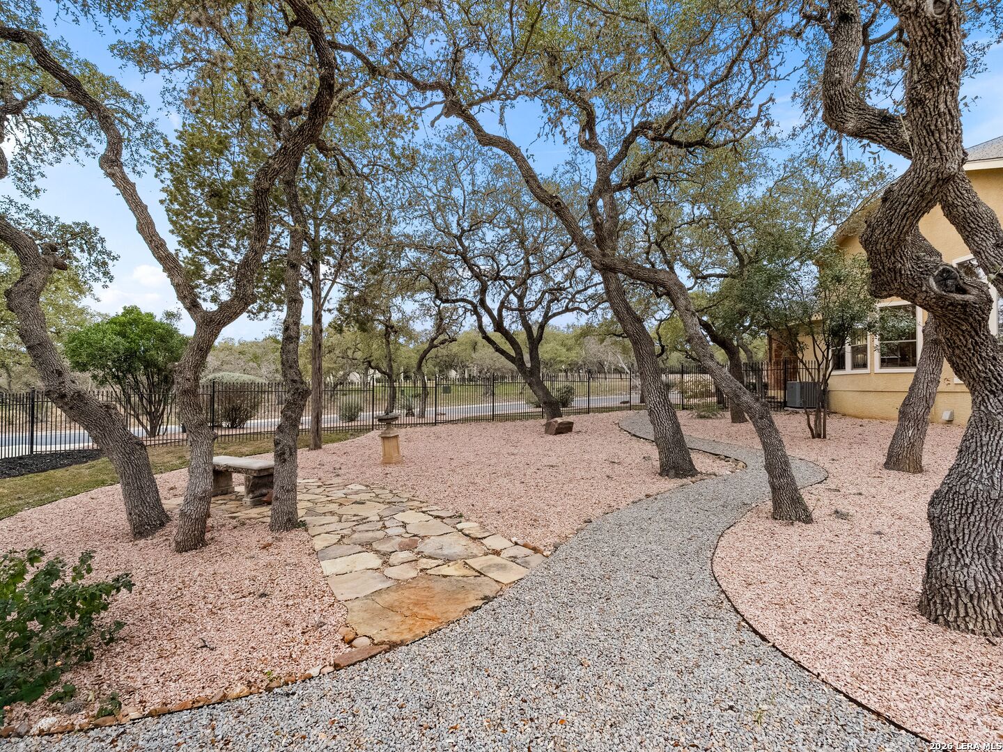 19819 Wild Hollow Garden Ridge, TX 78266 - Photo 58 of 68 a view of a backyard with large trees