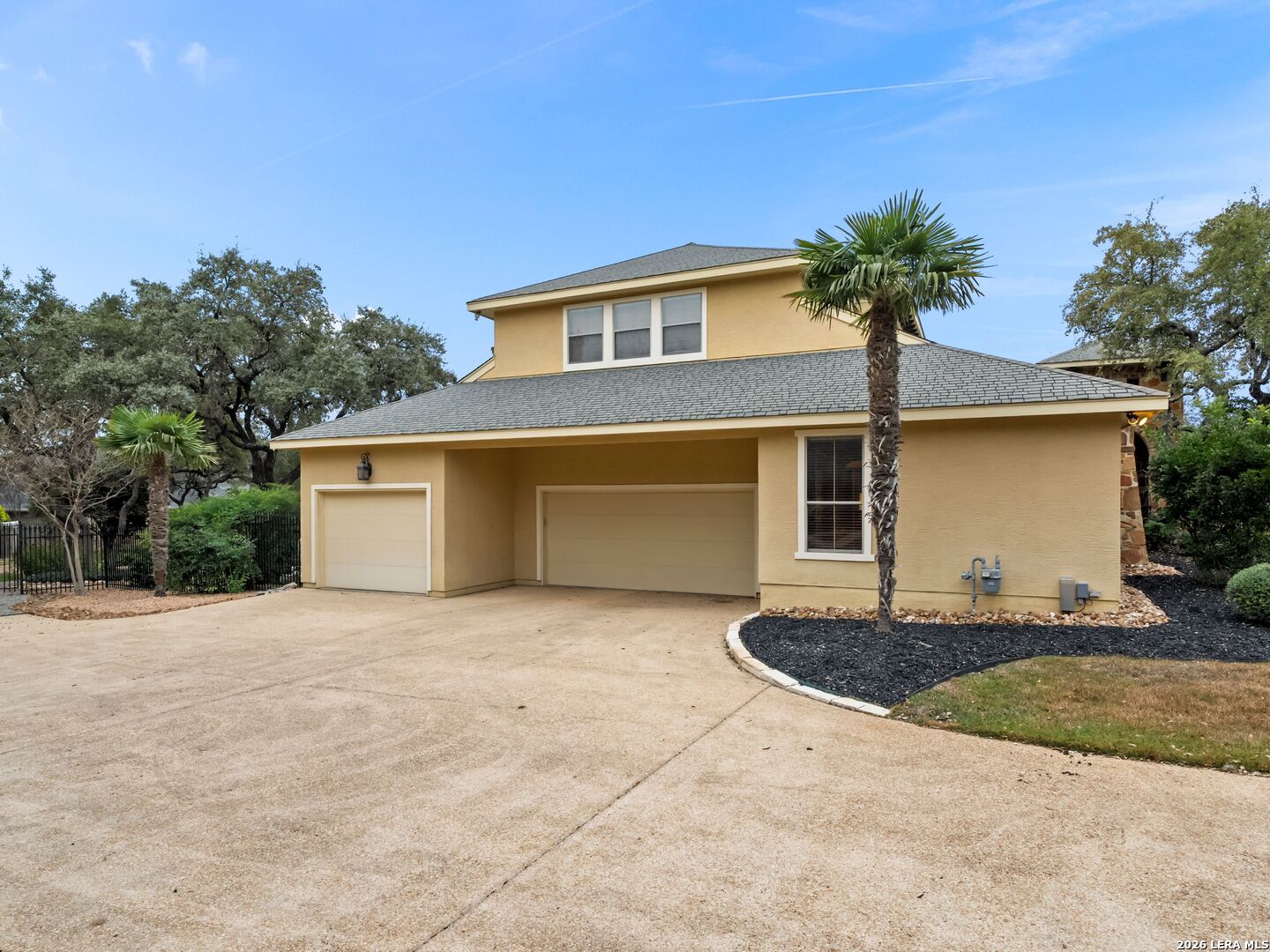 19819 Wild Hollow Garden Ridge, TX 78266 - Photo 59 of 68 a front view of a house with a yard
