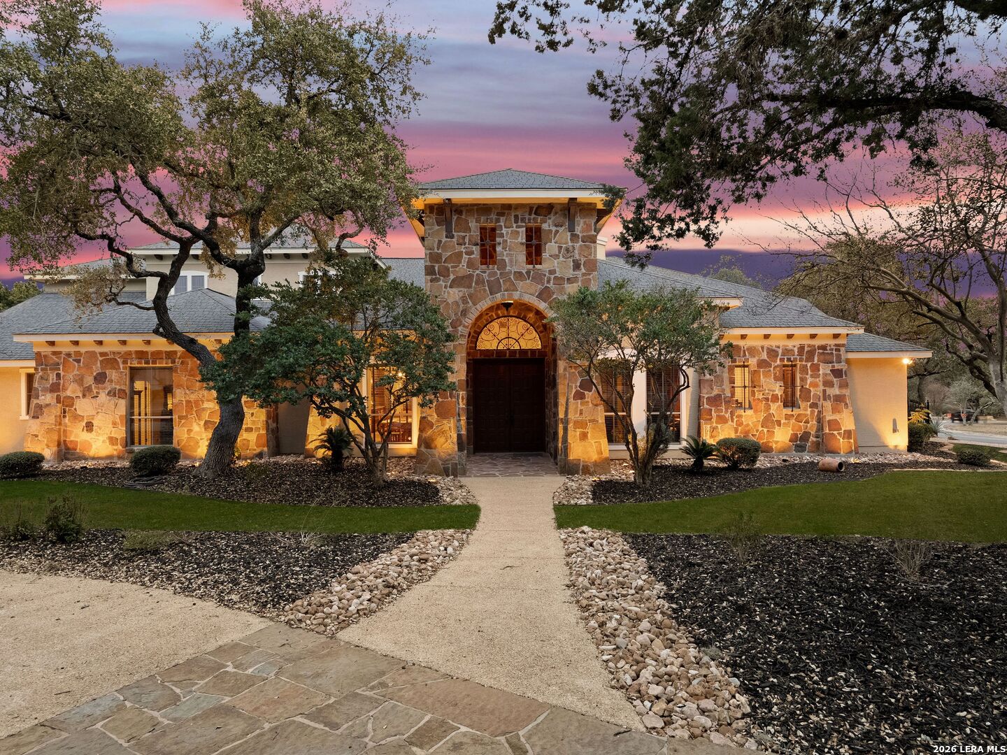 19819 Wild Hollow Garden Ridge, TX 78266 - Photo 6 of 68 a front view of a house with a garden