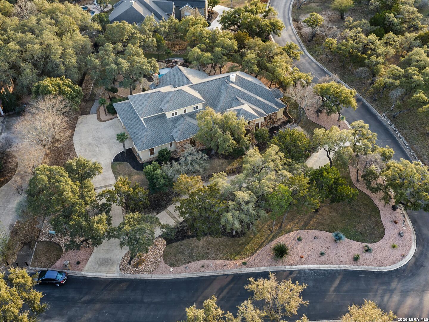 19819 Wild Hollow Garden Ridge, TX 78266 - Photo 63 of 68 an aerial view of a house with a yard