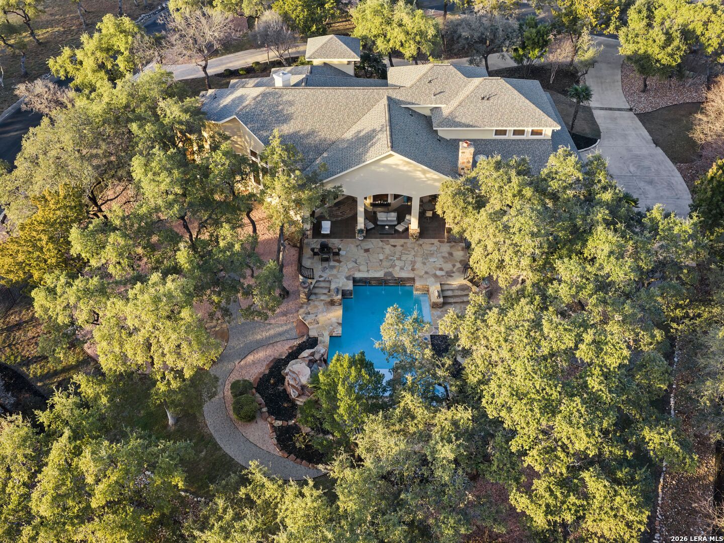 19819 Wild Hollow Garden Ridge, TX 78266 - Photo 66 of 68 a view of a house with a yard and garden