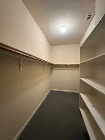 a view of an empty walk in closet