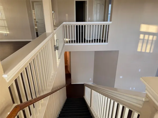 a view of a balcony with wooden floor