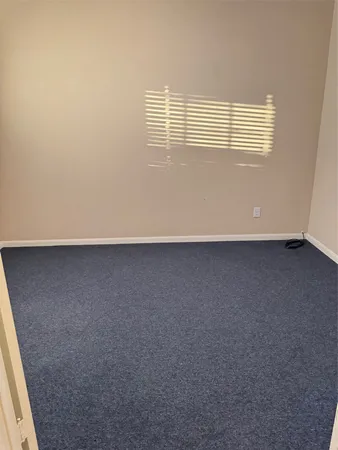 an empty room with wooden floor