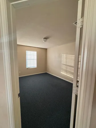 a view of a room that has a window in it