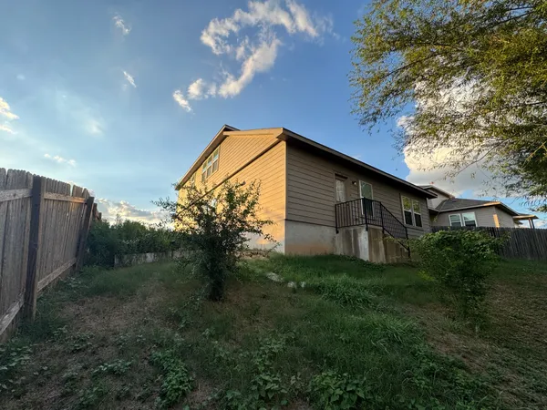 a backyard of a house with lots of green space