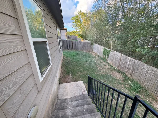 a view of balcony with wooden floor