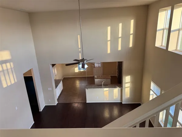 a view of a living room with furniture and a flat screen tv