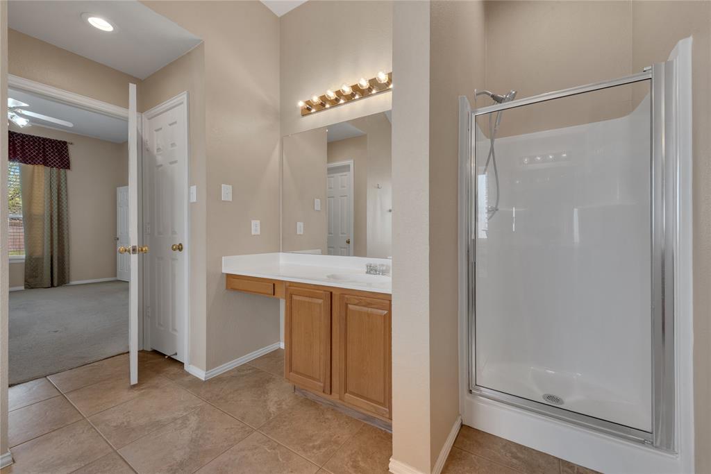 910 Derby Court Celina, TX 75009 - Photo 16 of 27 a view of a bathroom with mirror