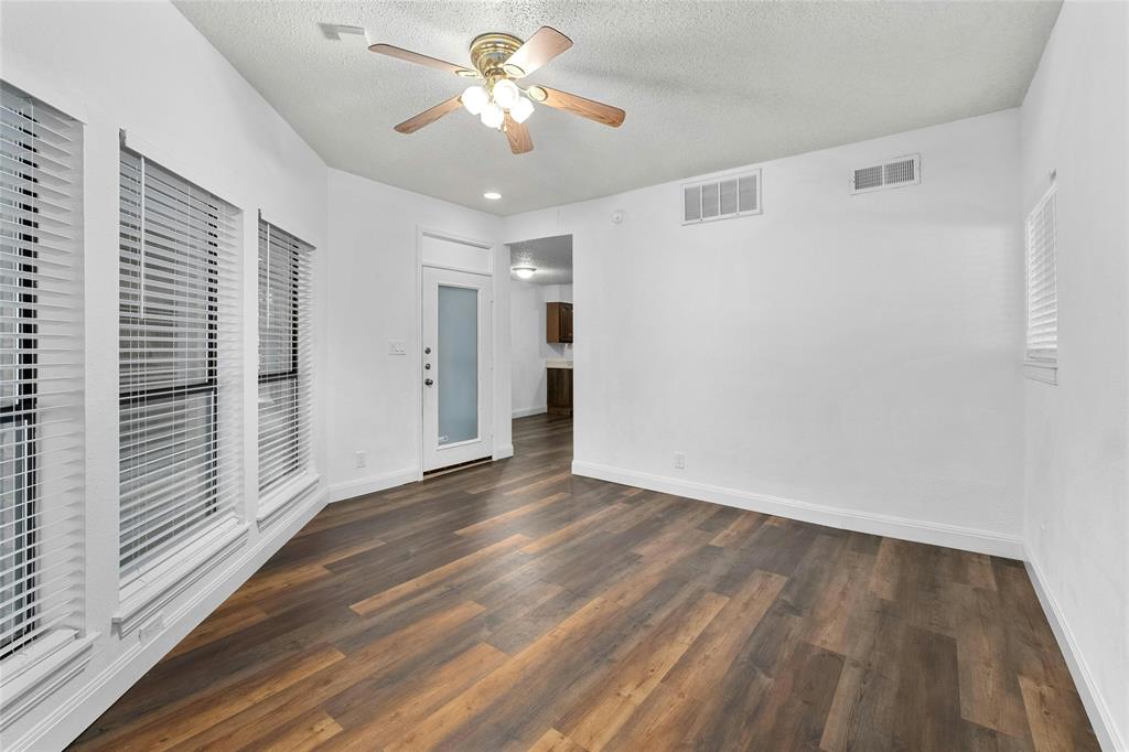 1910 Robbins Place, Unit 103 Austin, TX 78705 - Photo 3 of 16 Living room featuring large windows