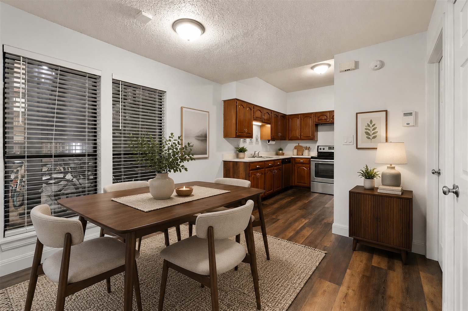 1910 Robbins Place, Unit 103 Austin, TX 78705 - Photo 4 of 16 Dining area with wood-finish flooring, four large windows with blinds, and white wall finishes. Virtually staged.