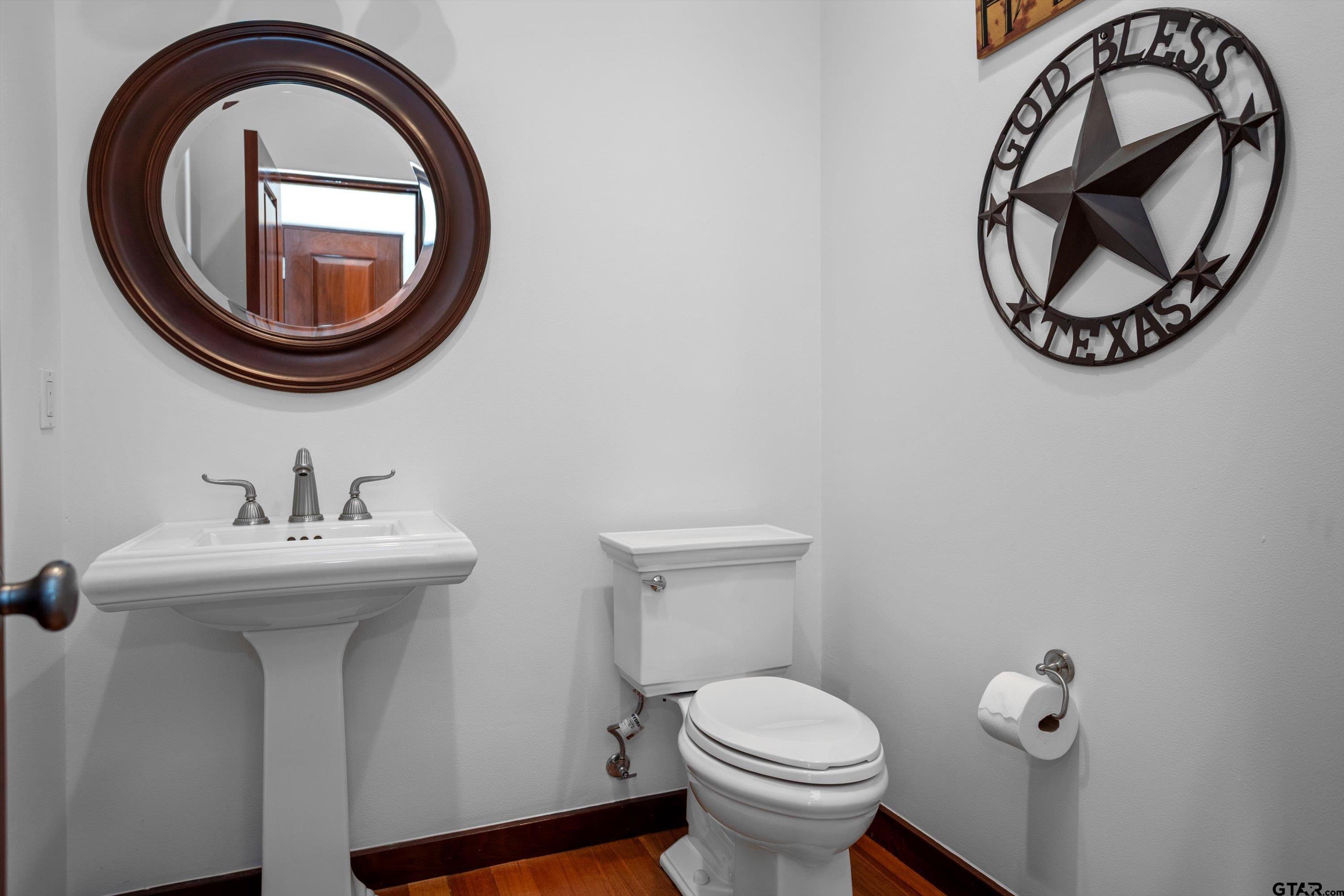 656 Vineyard View Ranch Grapeland, TX 75844 - Photo 18 of 31 a bathroom with a sink and a mirror