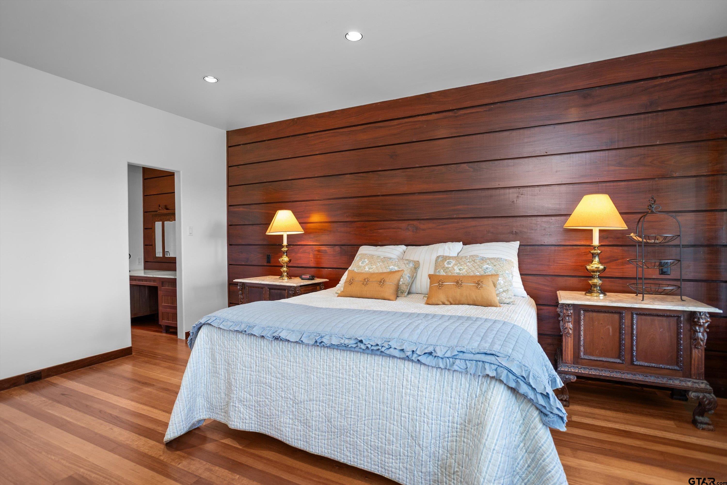 656 Vineyard View Ranch Grapeland, TX 75844 - Photo 20 of 31 a bedroom with a bed and a mirror