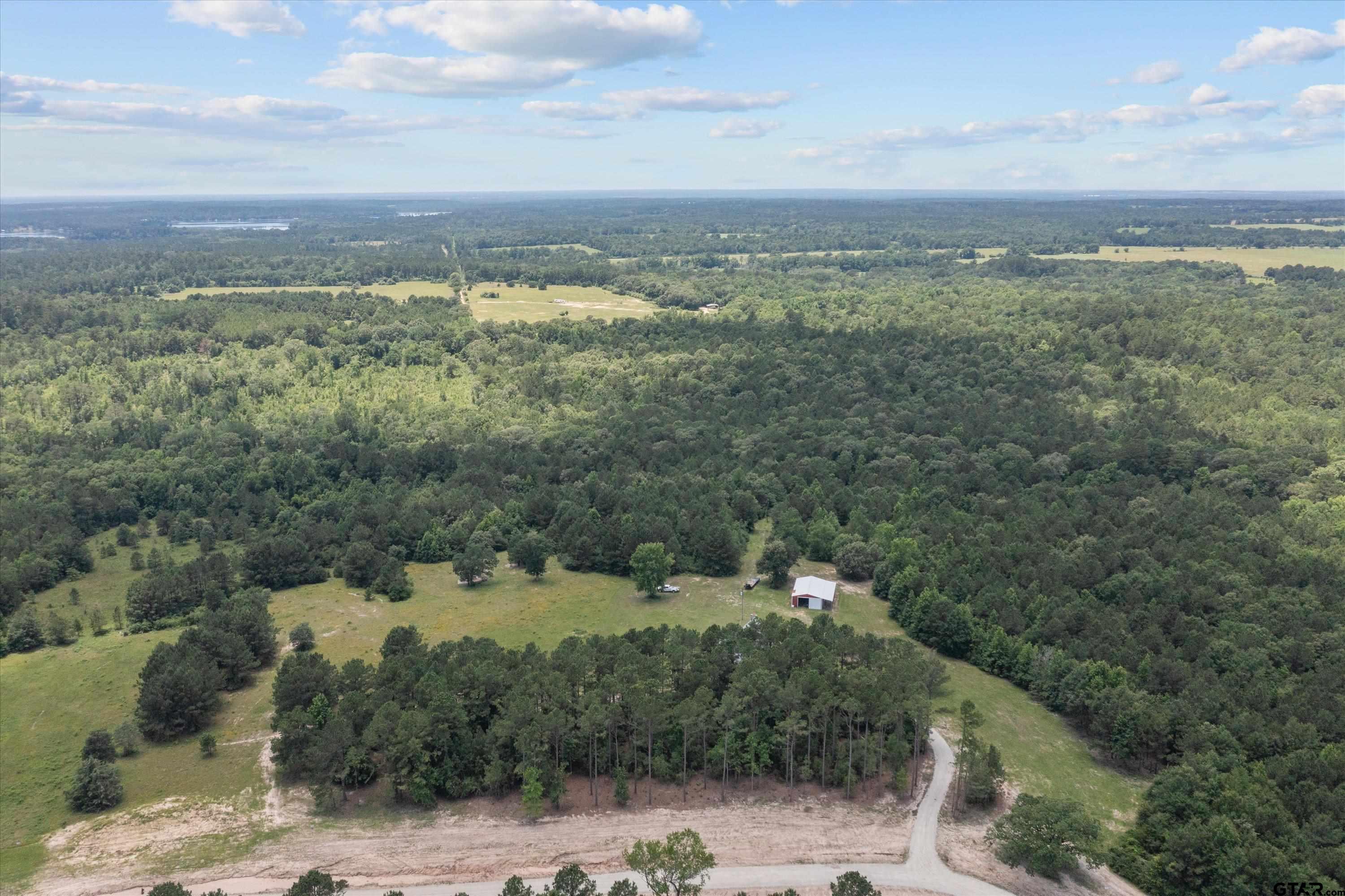 656 Vineyard View Ranch Grapeland, TX 75844 - Photo 2 of 31 a view of a city with mountains in the background