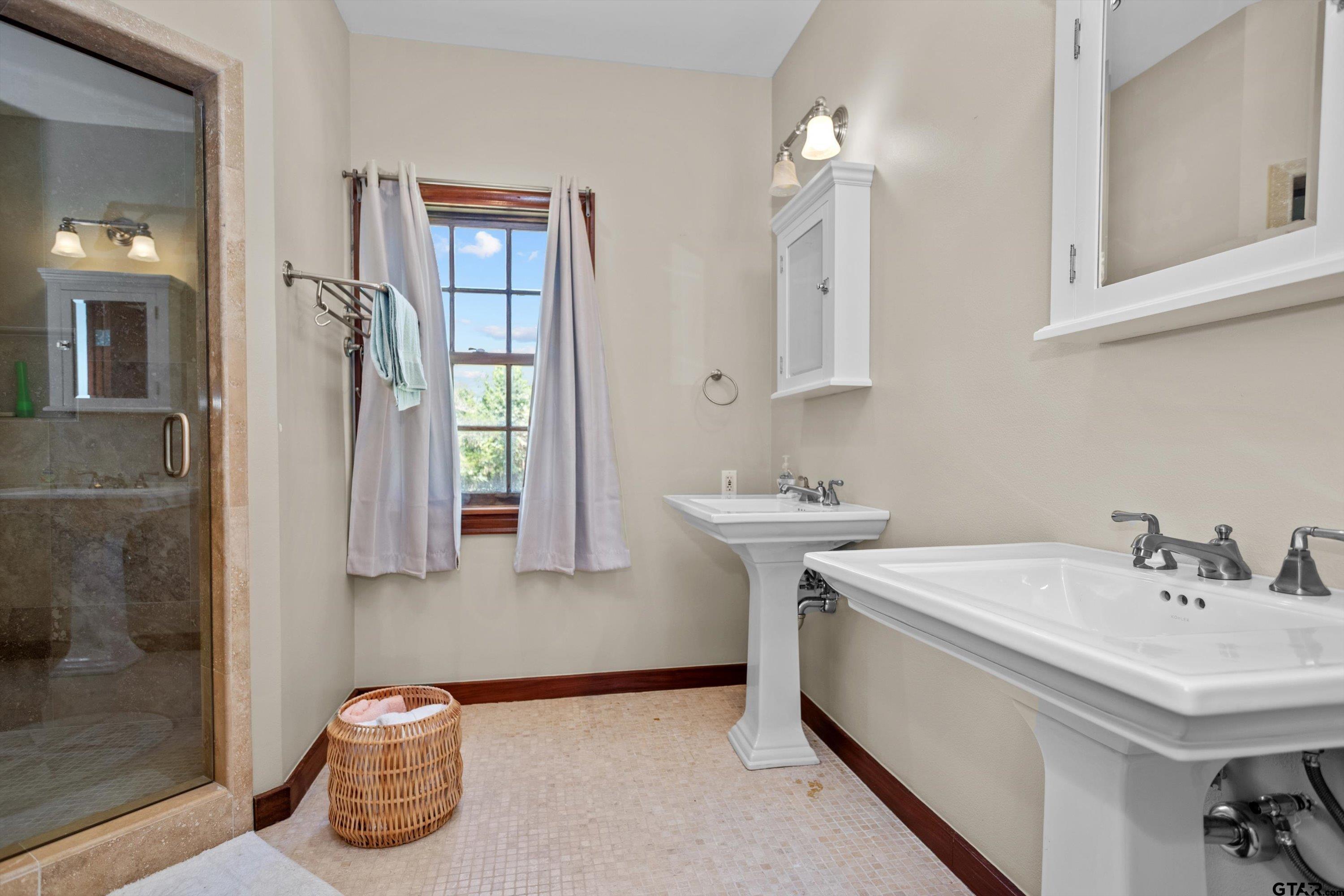 656 Vineyard View Ranch Grapeland, TX 75844 - Photo 22 of 31 a bathroom with a sink and a mirror