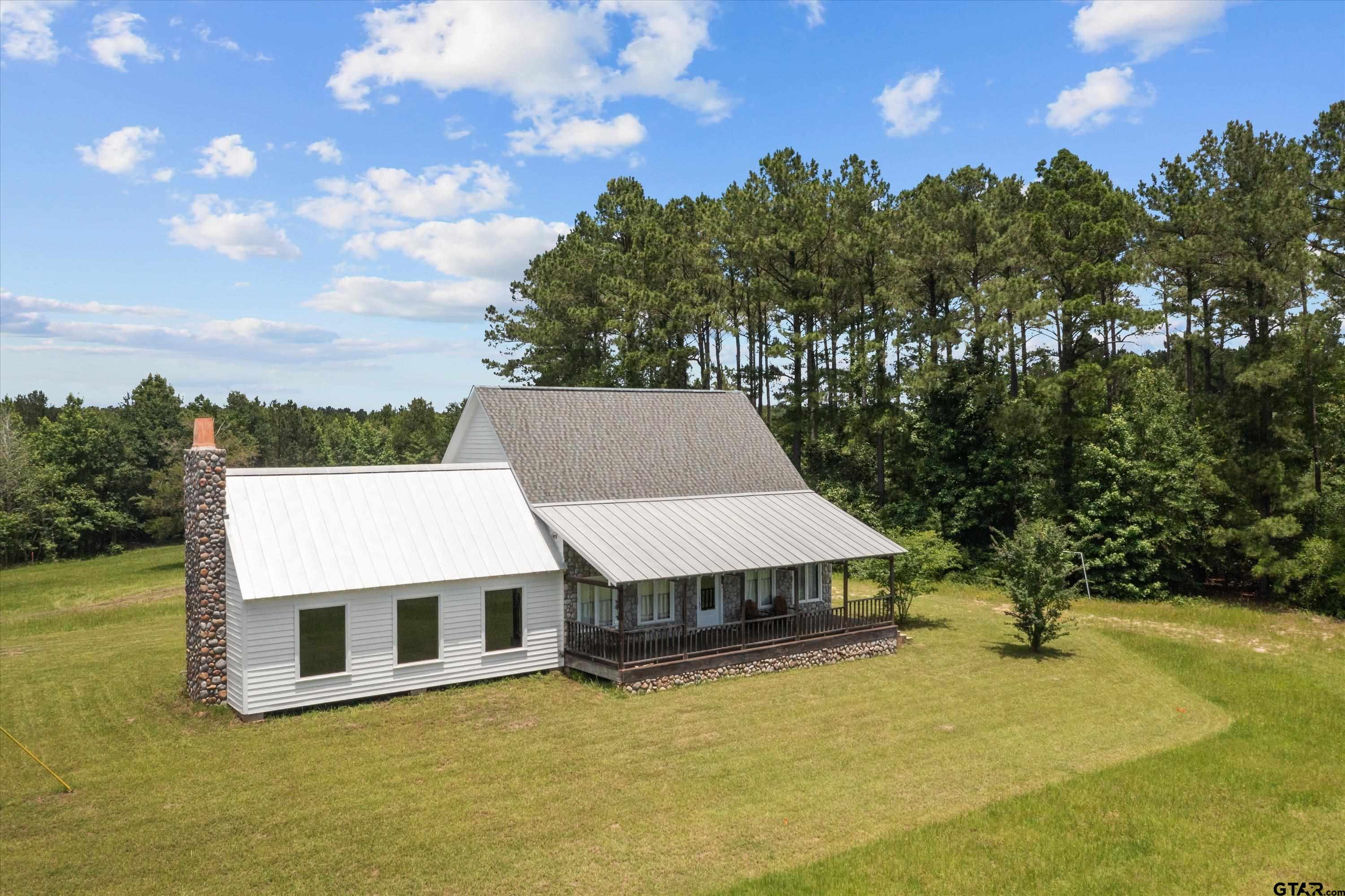 656 Vineyard View Ranch Grapeland, TX 75844 - Photo 4 of 31 a view of a house with a backyard