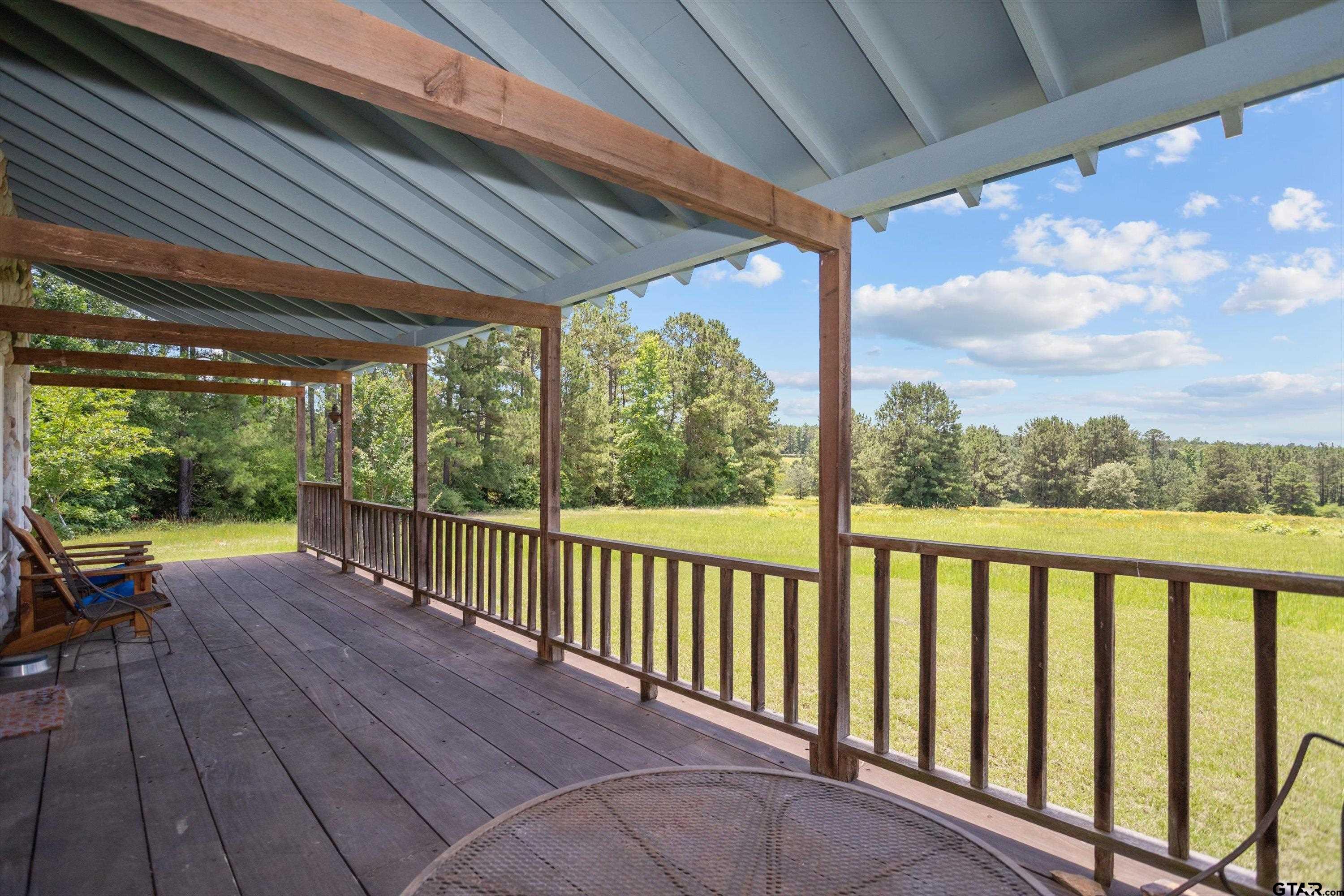 656 Vineyard View Ranch Grapeland, TX 75844 - Photo 6 of 31 a view of a patio with wooden floor