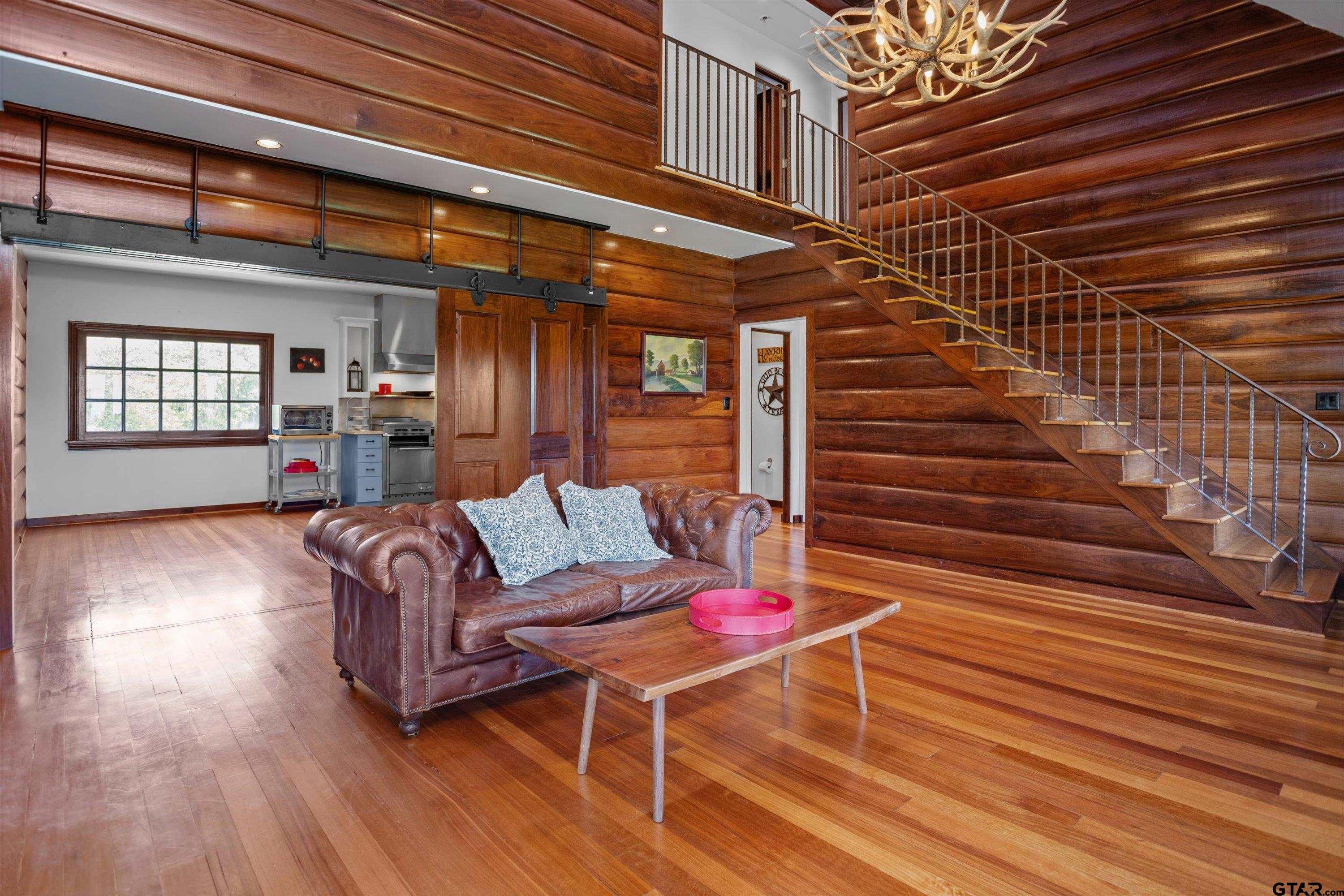 656 Vineyard View Ranch Grapeland, TX 75844 - Photo 8 of 31 a outdoor living space with patio furniture and wooden floor