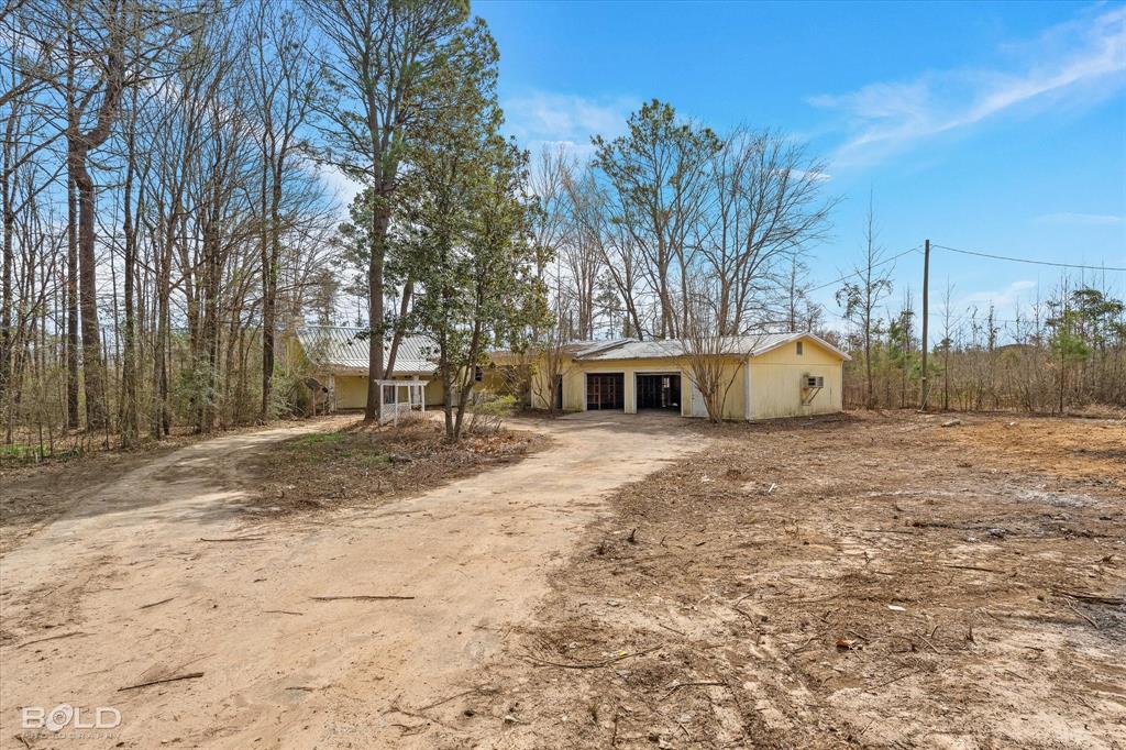 2976 Highway 534 Homer, LA 71040 - Photo 1 of 1 a white house that has a tree in front of it
