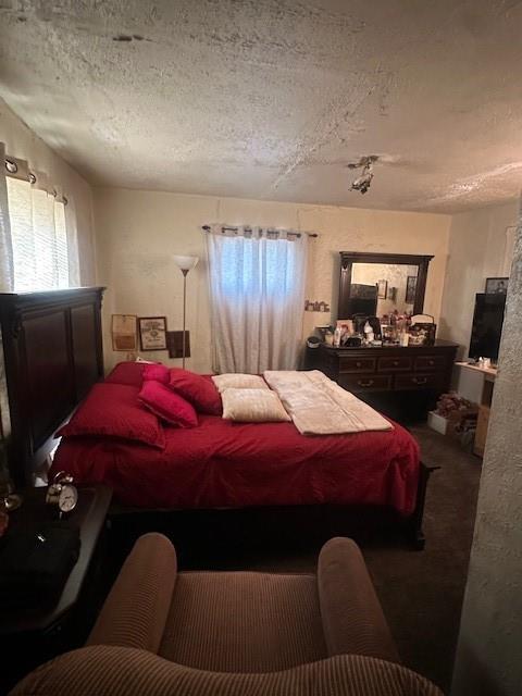 2340 Macon Street Dallas, TX 75215 - Photo 16 of 30 a bed room with a bed and a television