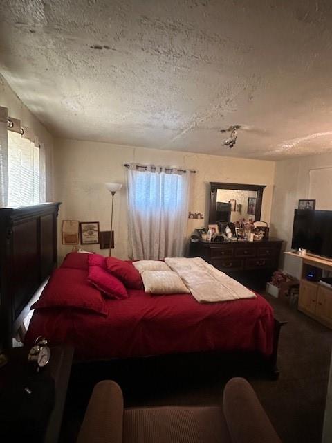 2340 Macon Street Dallas, TX 75215 - Photo 17 of 30 a bedroom with a bed and a tv