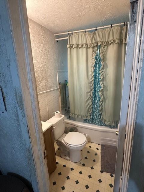 2340 Macon Street Dallas, TX 75215 - Photo 10 of 30 a bathroom with a shower curtain and a toilet