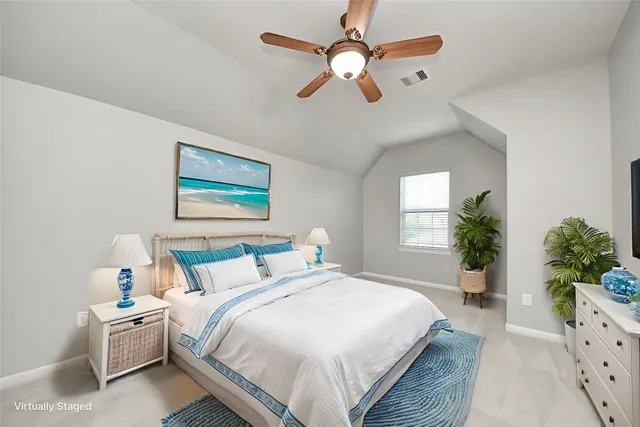 a bedroom with bed and window