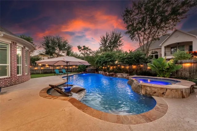 a view of a swimming pool with an outdoor space and seating area