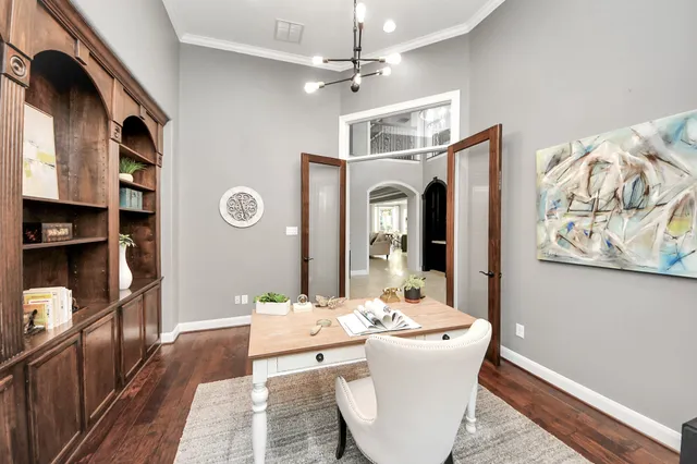 a living room with stainless steel appliances kitchen island granite countertop furniture and a fireplace