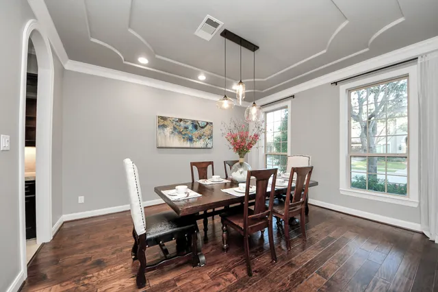 a view of a dining room with furniture window and wooden floor