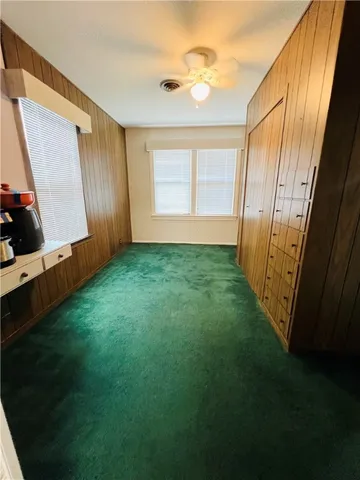 a view of a back yard from a room