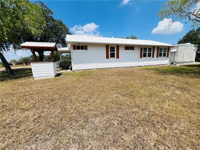 a view of a house with a swimming pool