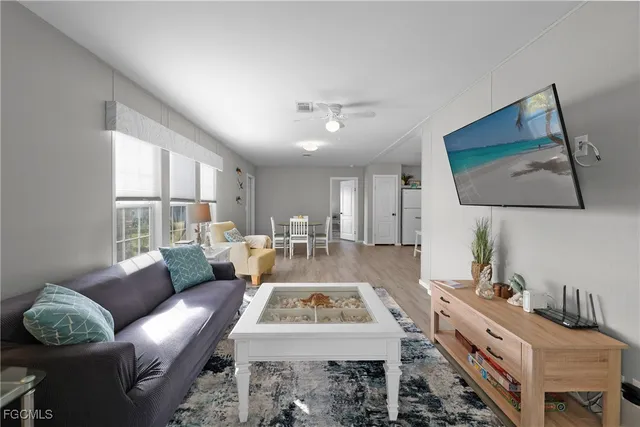a living room with furniture and a window