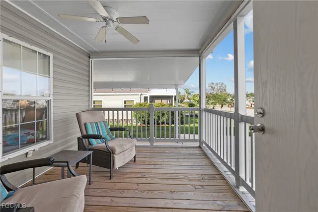 a balcony view with a seating space