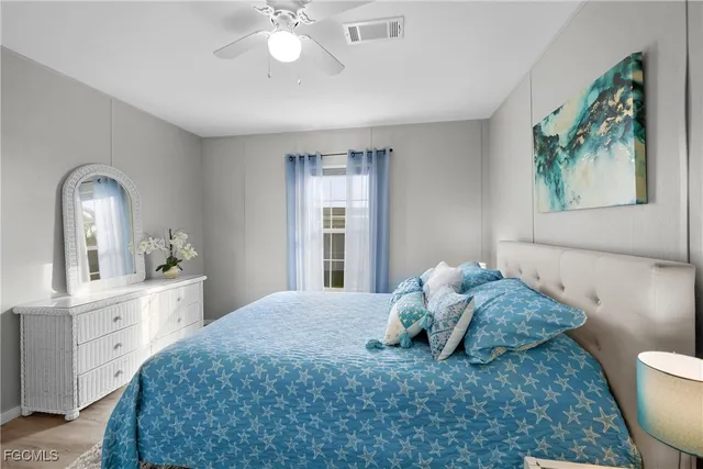 a bedroom with a large bed and a window