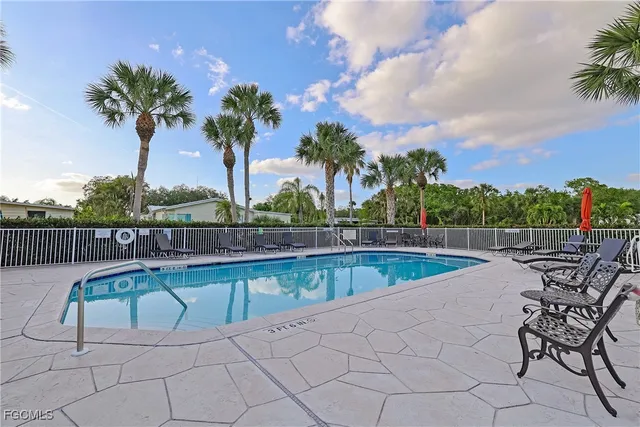 a view of a swimming pool with a lounge chair