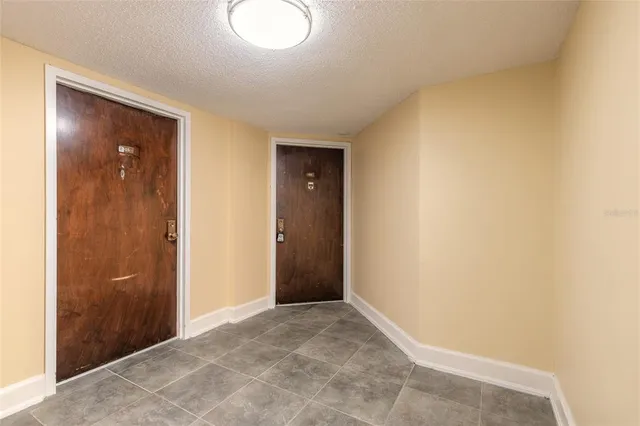 a view of an empty room and closet area