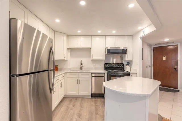a view of a kitchen with a sink