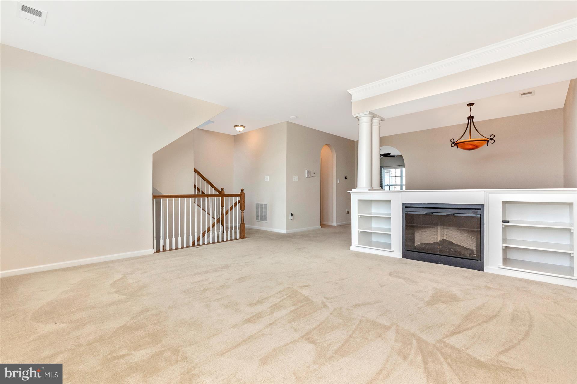 1832 Monocacy View Circle Frederick, MD 21701 - Photo 2 of 30 a view of a livingroom with a fireplace and entryway