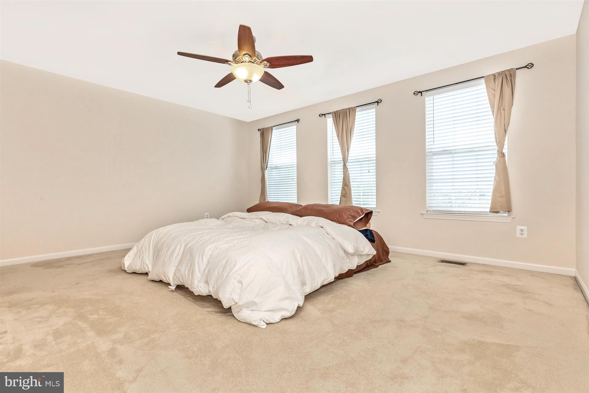 1832 Monocacy View Circle Frederick, MD 21701 - Photo 15 of 30 a bed sitting in a bedroom next to a window