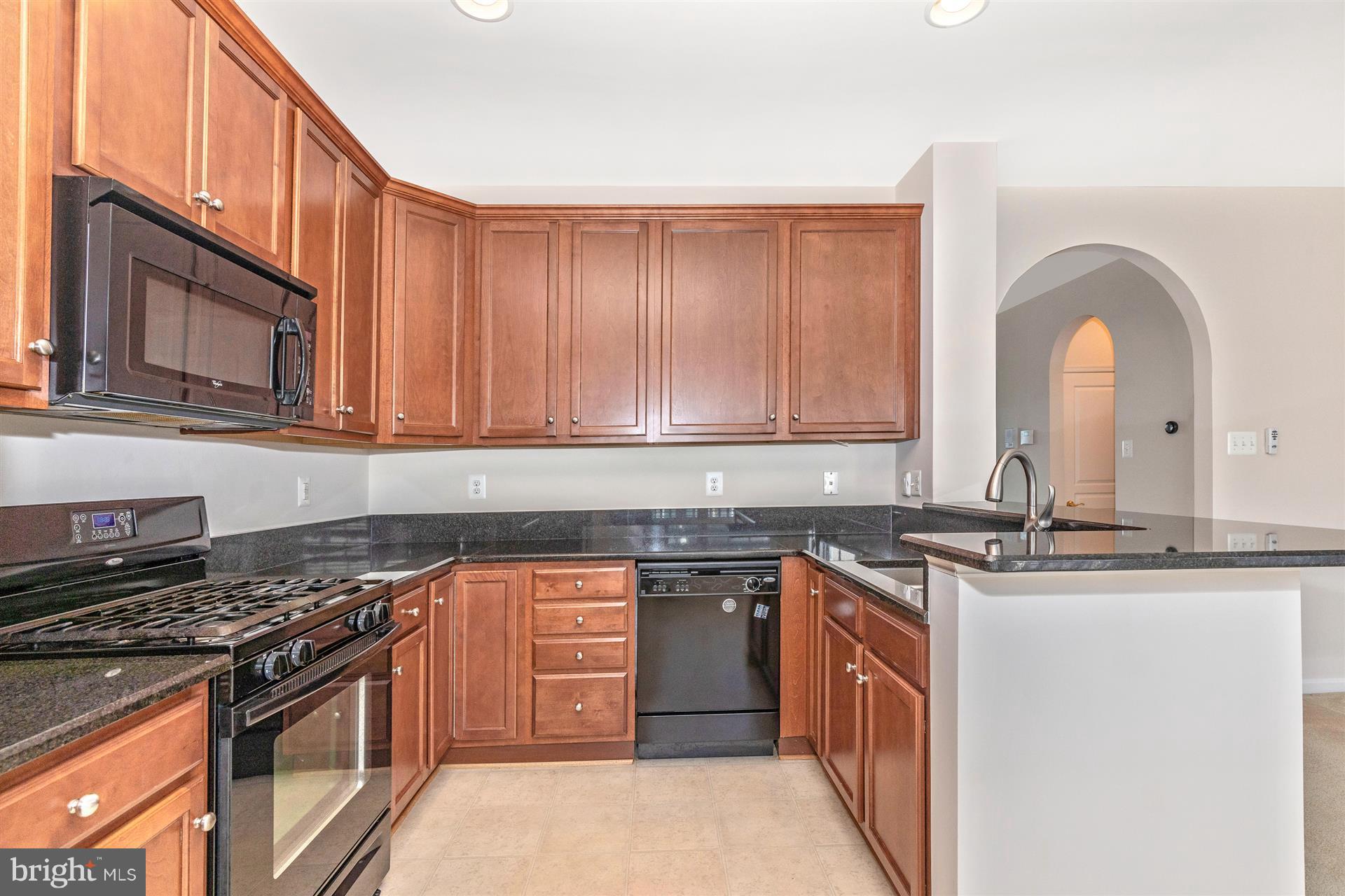 1832 Monocacy View Circle Frederick, MD 21701 - Photo 8 of 30 a kitchen with stainless steel appliances granite countertop a stove top oven sink and cabinets