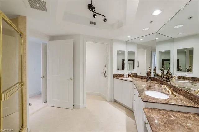 a kitchen with sink refrigerator and stove