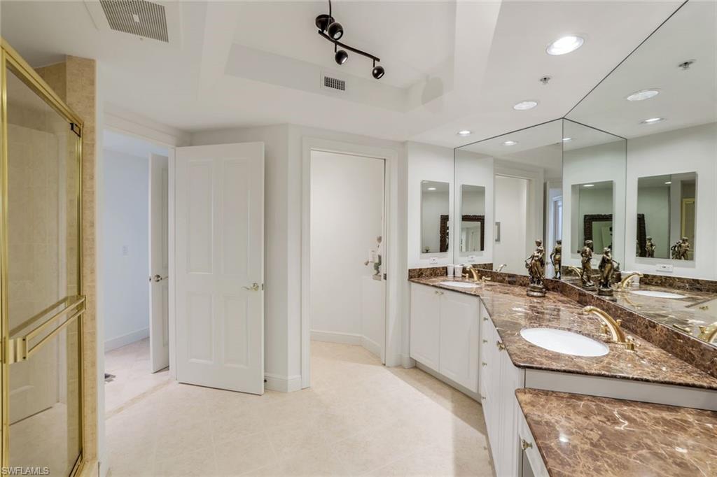 1060 Borghese Lane, Unit 1005 Naples, FL 34114 - Photo 14 of 38 a kitchen with sink refrigerator and stove