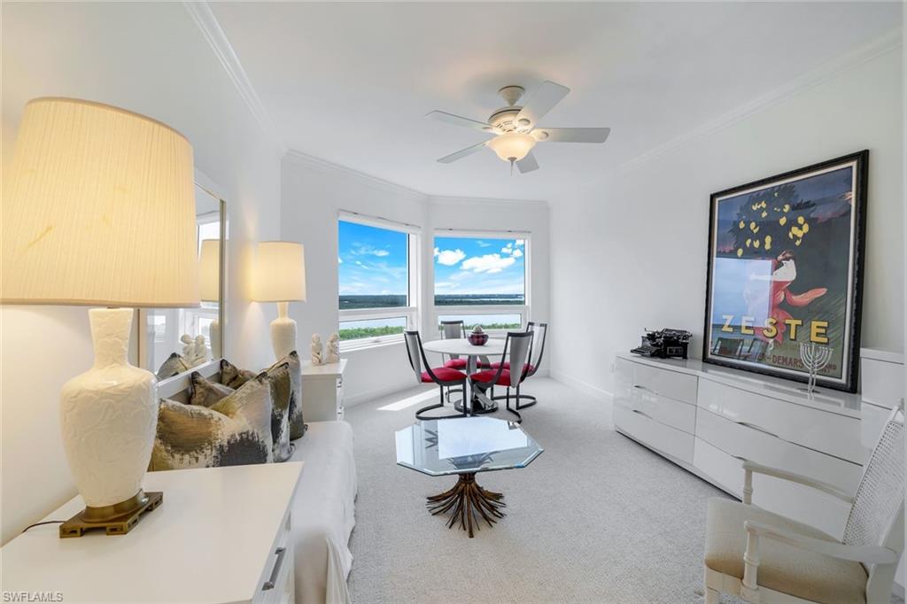 1060 Borghese Lane, Unit 1005 Naples, FL 34114 - Photo 16 of 38 a living room with furniture and a large window
