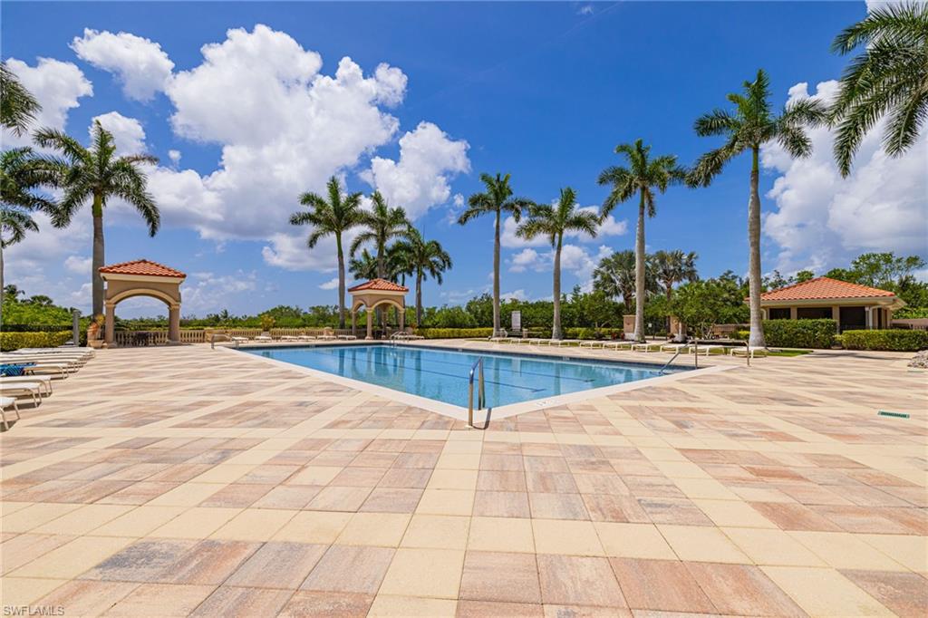 1060 Borghese Lane, Unit 1005 Naples, FL 34114 - Photo 37 of 38 a view of swimming pool with outdoor seating