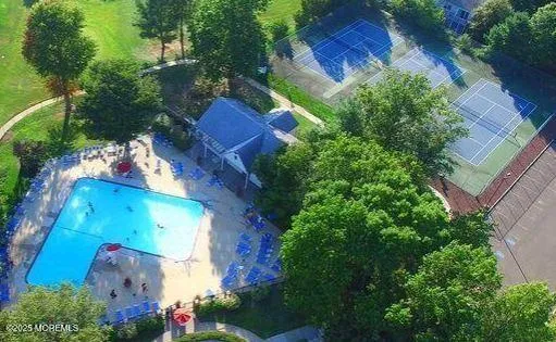 an aerial view of a house with a yard
