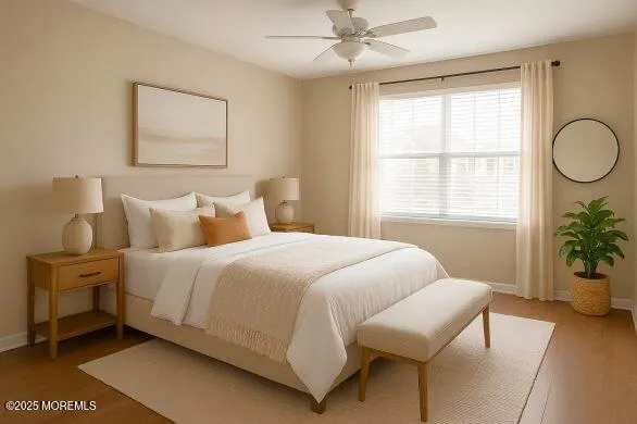 a bedroom with a bed and potted plant