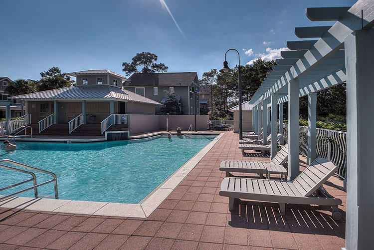 83 Constant Avenue Santa Rosa Beach, FL 32459 - Photo 12 of 19 a view of a house with backyard porch and sitting area