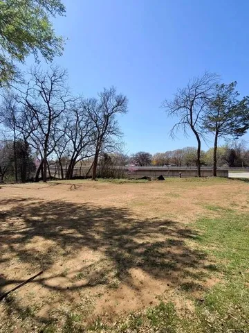 a view of yard covered with snow